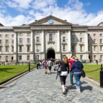 Dublin, Ireland - May 19th, 2011: One of the greatest Dublin landmarks Trinity College. A lot of tourists and students can be seen entering and leaving the campus.