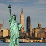 new york cityscape skyline empire state building and statue of liberty