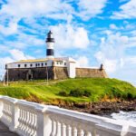 Salvador da Bahia, Brazil - May 29, 2016: View of Farol da Barra Lighthouse at Barra beach in Salvador da Bahia, Brazil. Dating from the year 1698, it is said to be the oldest lighthouse in South America.